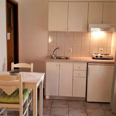 Apartment Ikos And *